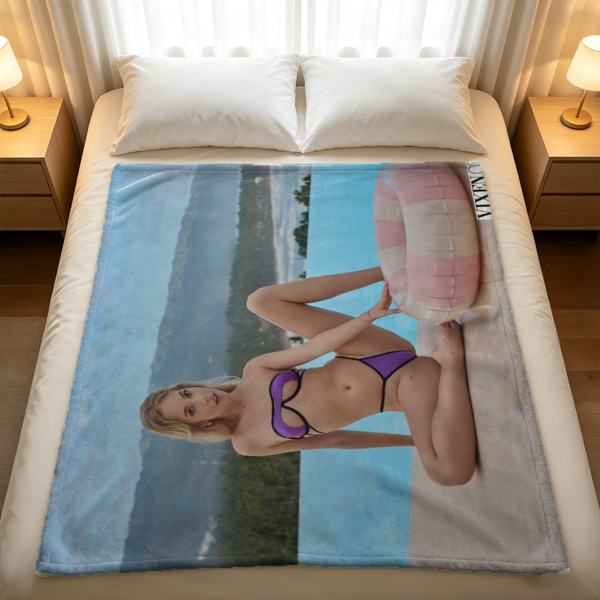 A young Asian woman in elaborate black pearl lingerie kneeling on the floor. - Blanket
