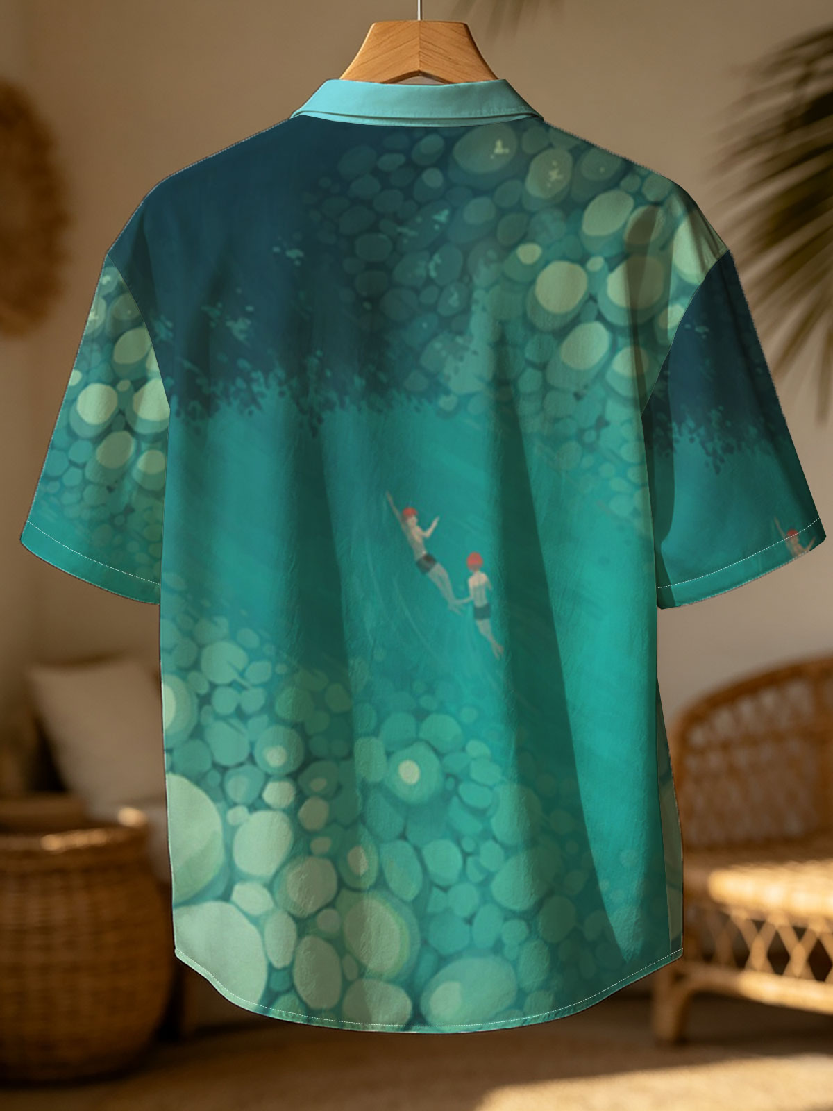 Two swimmers glide through a serene, rocky underwater tunnel. -  Shirt