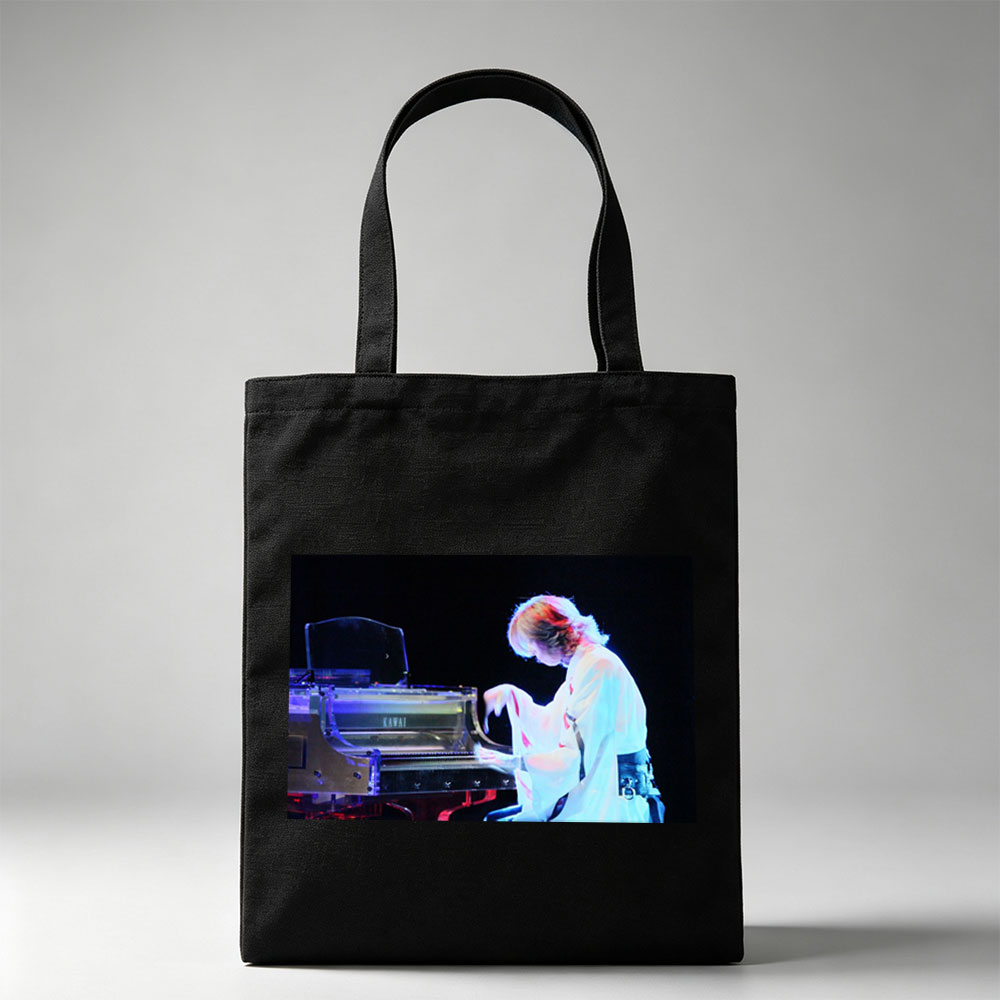 Yuki Kajiura Performing Piano on Stage with Dramatic Lighting - Canvas tote bags