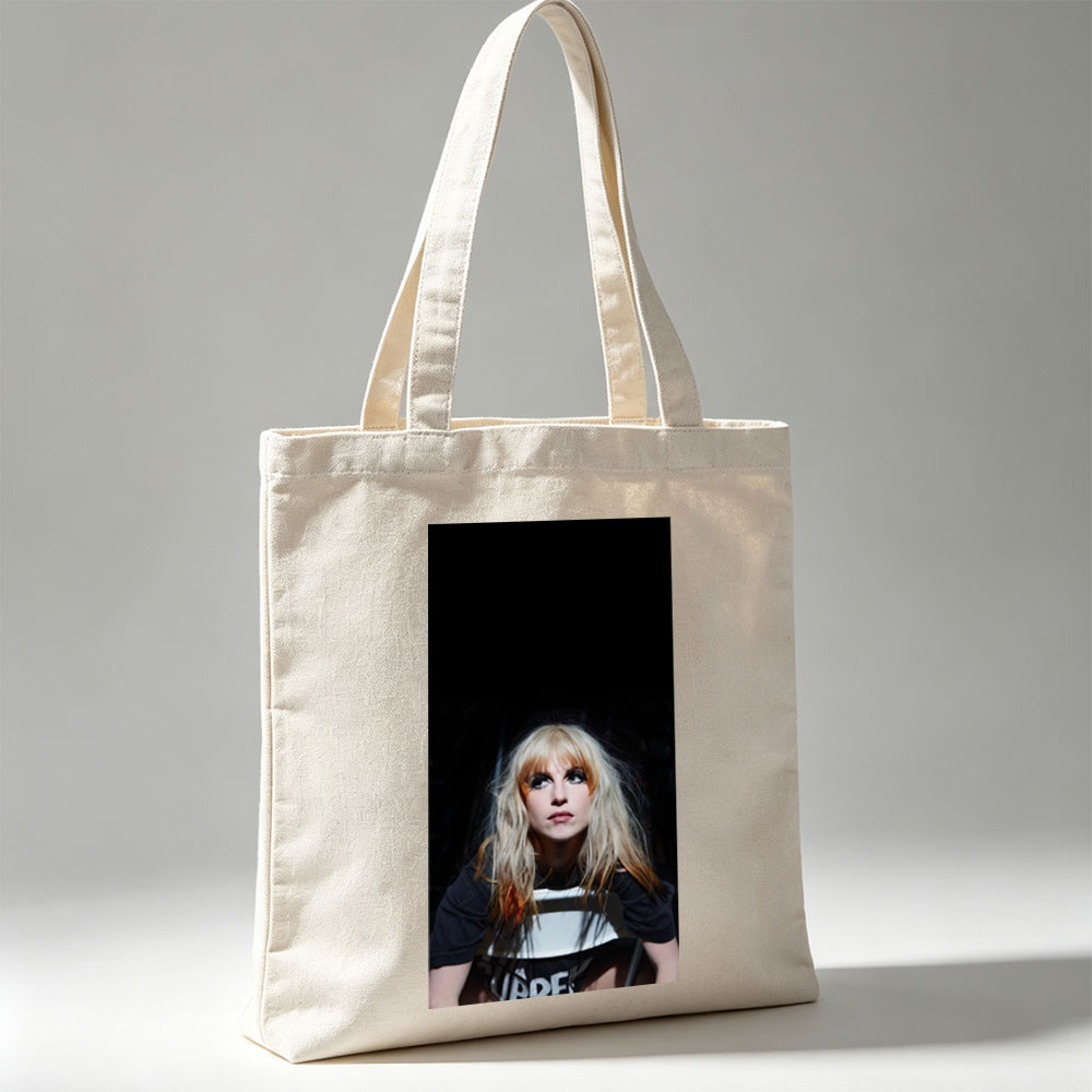Hayley Williams in a Dramatic Portrait with Intense Gaze and Blonde Hair Against Dark Background - Canvas tote bags