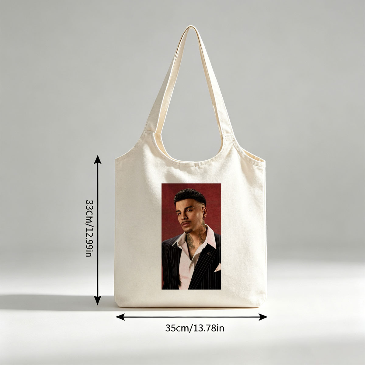 Maluma in a Pinstripe Suit with Visible Neck Tattoos Against a Red Background - Canvas shoulder bags/