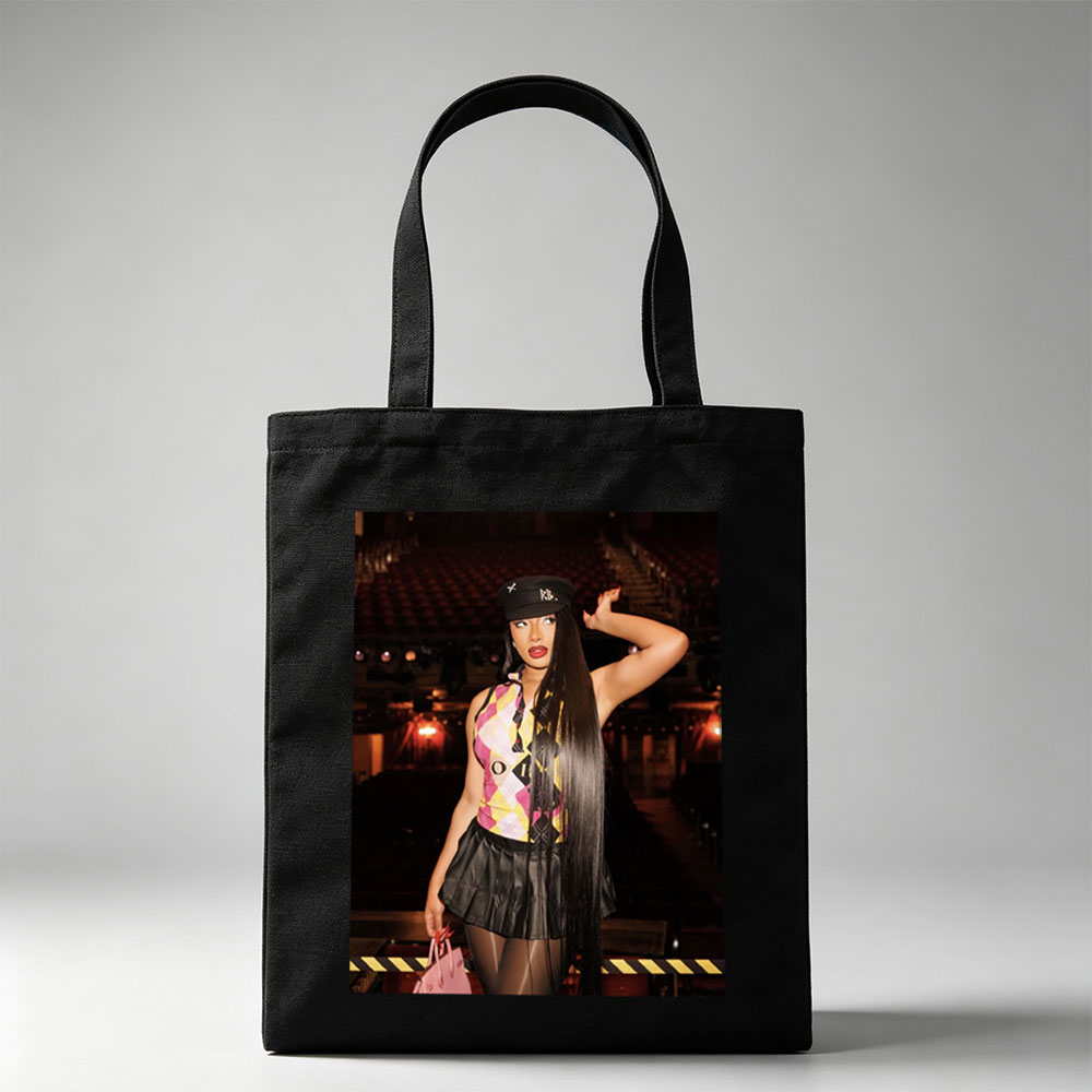 Cardi B in a Bold Outfit at a Concert Venue with Vibrant Lighting and Stage Setup - Canvas tote bags