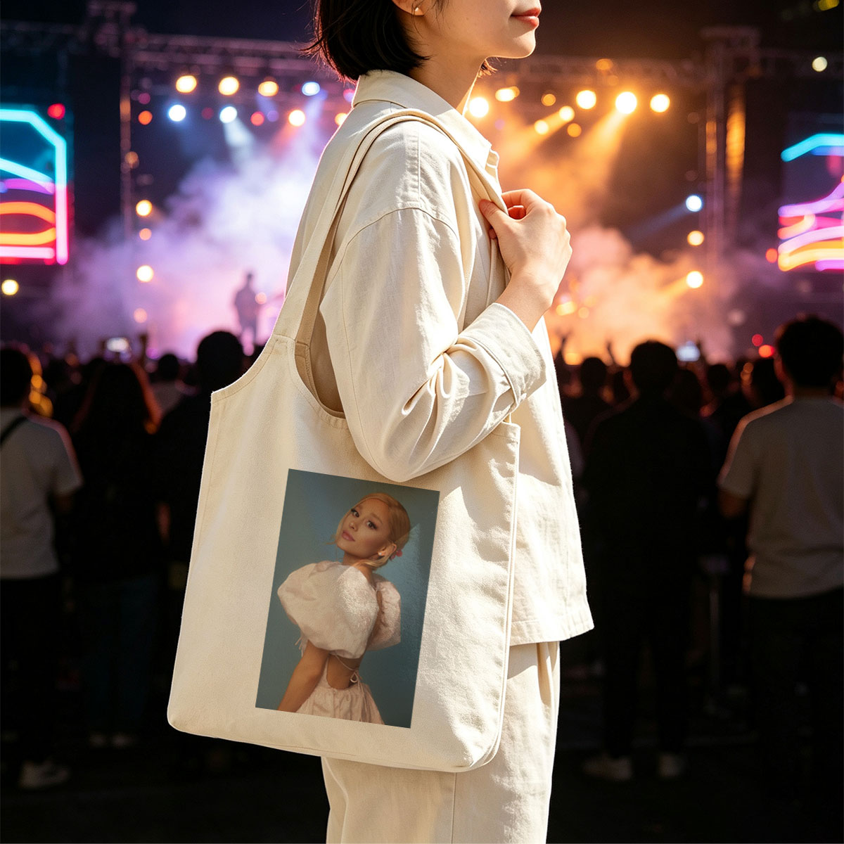 Ariana Grande in a Soft Pink Dress with Puffy Sleeves and Back Cutout Pose Against Blue Background - Canvas shoulder bags/