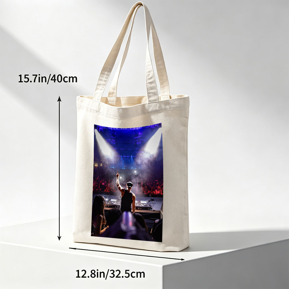 DJ Martin Garrix Performing at a High-Energy Concert with Crowd in the Background - Canvas tote bags
