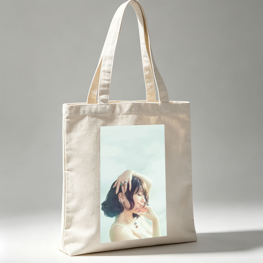 Nana Mizuki in a Serene Pose with Elegant Jewelry and Soft Lighting - Canvas tote bags