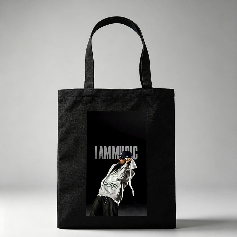 IamMusic Artist in Stylish Pose Wearing Hoodie and Cap Against Dark Background - Canvas tote bags
